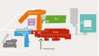 Übersichtskarte eines Gebäudekomplexes mit verschiedenen Bereichen: Baden, Pfalz, Württemberg, Schwarzwald, und Elsass, einschließlich Stationen und Aufzügen.